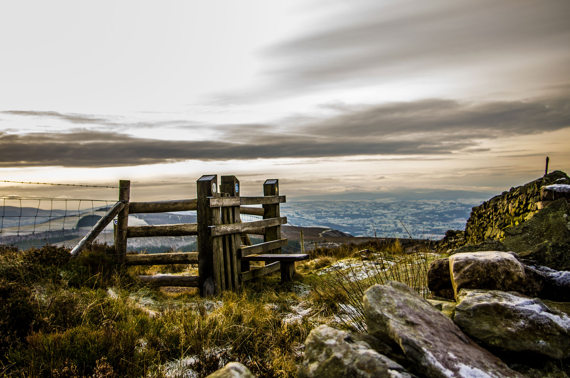 *Oak stile on Moel Famau with Vale of Clwyd in distance