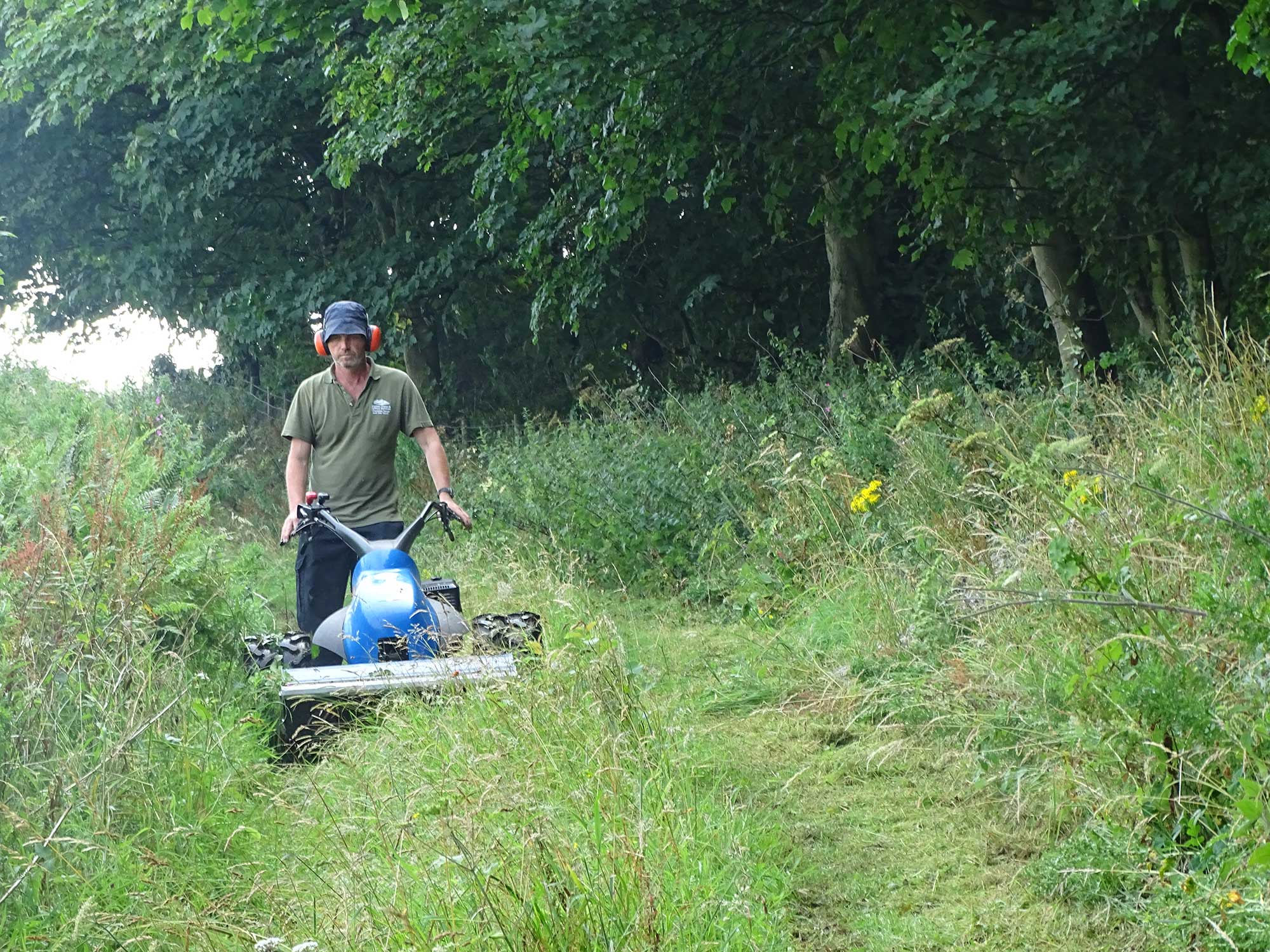 *AONB Ranger-mowing a wildflower meadow