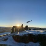Helicopter in snow at Sunset