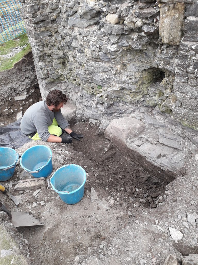 Archaeologist excavating Dinas Brân Castle