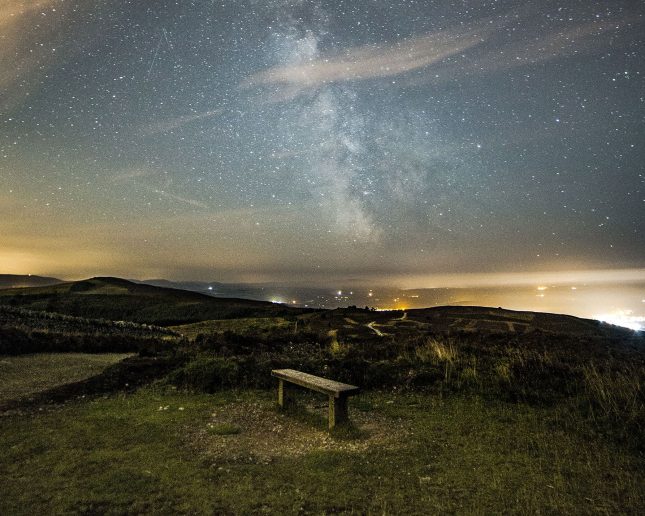 dark skies with bench